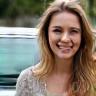 Emma Roberts, local teacher, next to her compact car