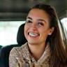 Maria Santos, busy mom, holding car keys and smiling after service