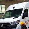 Tyrone Clark, delivery driver, by a freshly detailed van