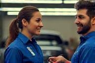 Friendly detailer delivering service to a smiling customer at Kihe Touch