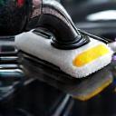 Paint polishing buffer in action showing reflection